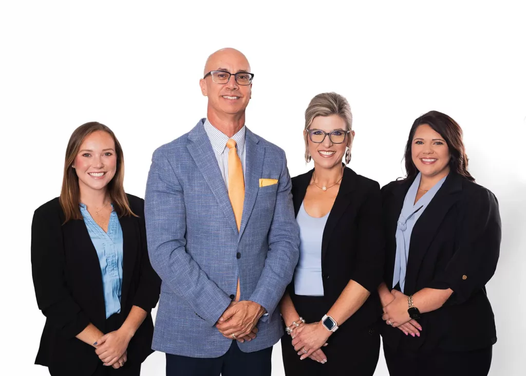 The Agape Wealth Strategies team of four standing together