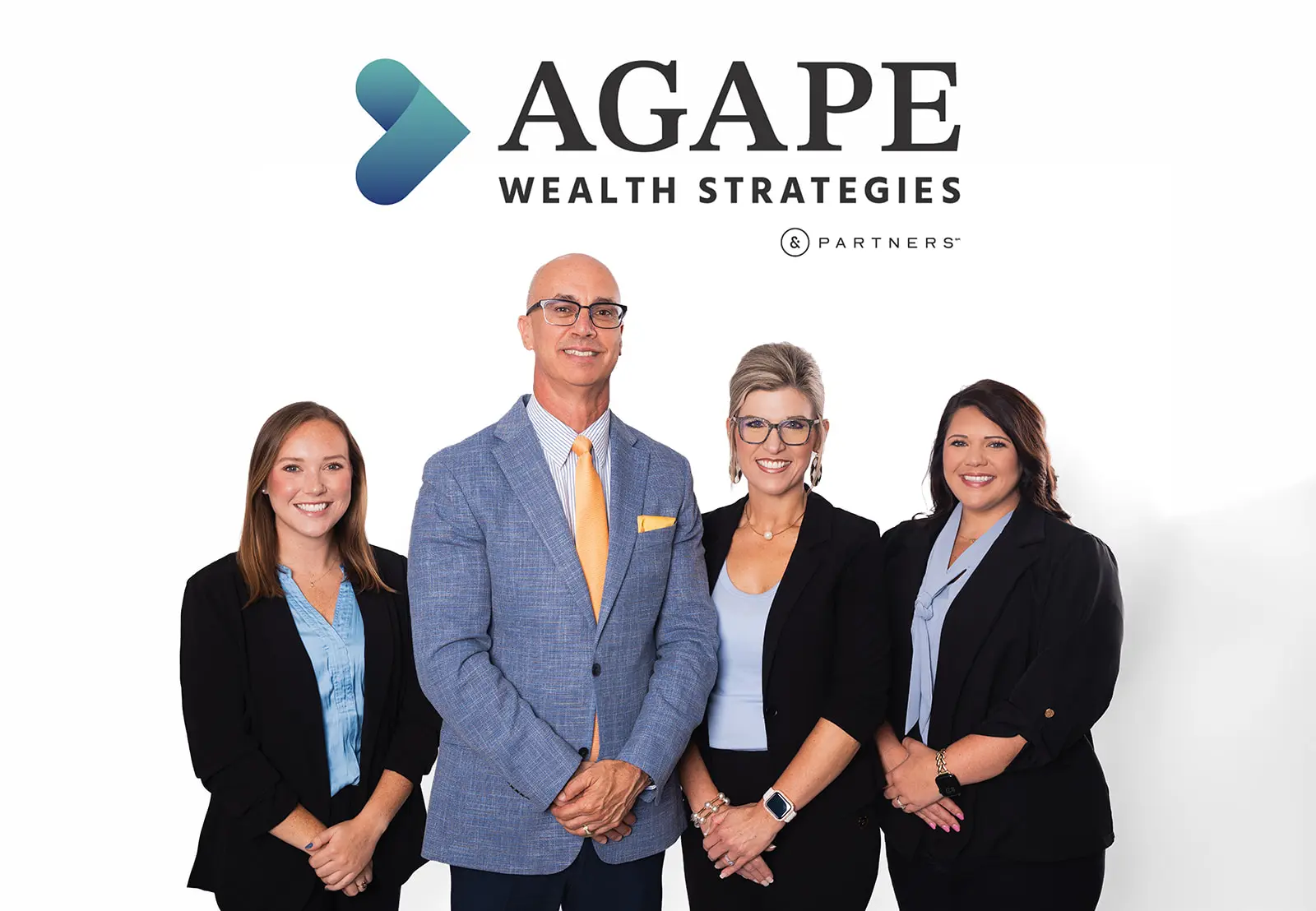 The Agape Wealth Strategies team of four standing together under the firm's logo